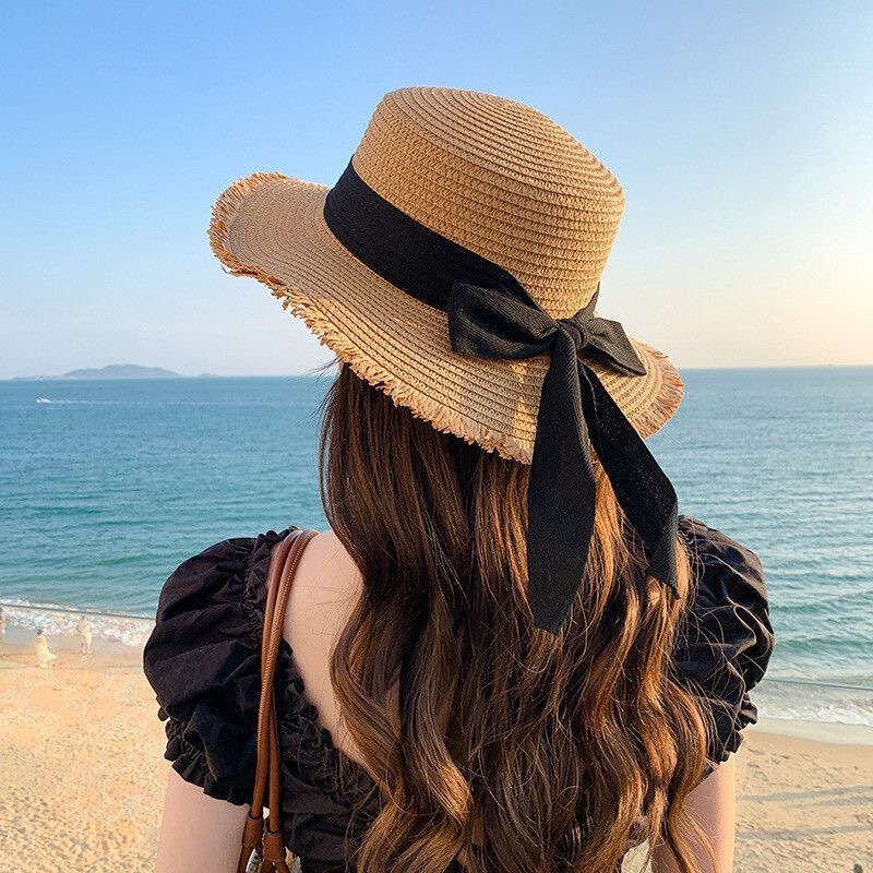 夏季编织遮阳帽女休闲海边沙滩遮阳防晒帽蝴蝶结毛边平顶草帽