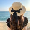 夏季编织遮阳帽女休闲海边沙滩遮阳防晒帽蝴蝶结毛边平顶草帽